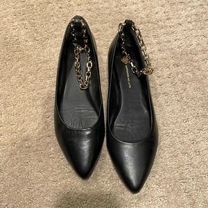 Black flats with ankle chain detail